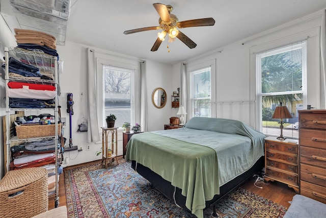 bedroom featuring a ceiling fan and wood finished floors