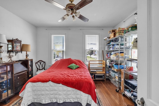 bedroom featuring a ceiling fan and wood finished floors