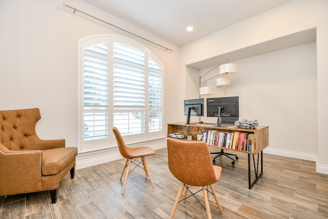 office featuring recessed lighting, wood finished floors, and baseboards