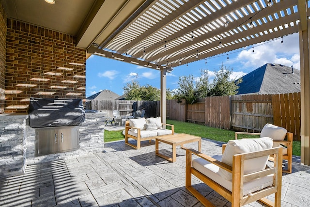 view of patio featuring grilling area, outdoor lounge area, a fenced backyard, and a pergola