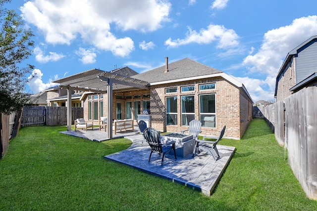 back of property with a pergola, a fenced backyard, an outdoor fire pit, brick siding, and a patio area