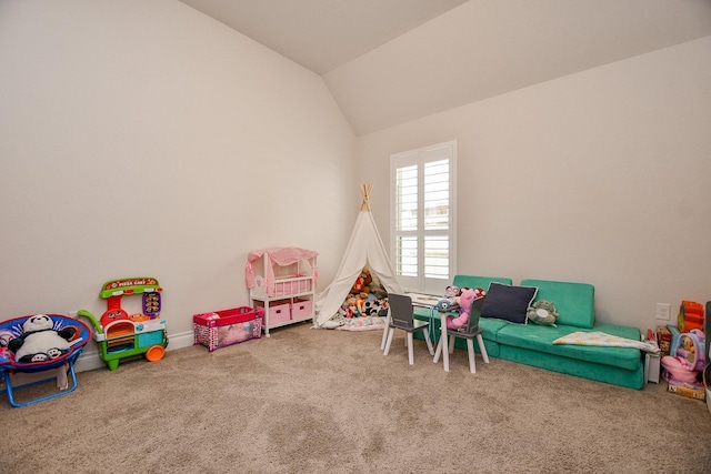 playroom featuring lofted ceiling and carpet floors