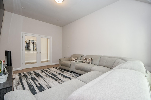 living room with french doors and baseboards