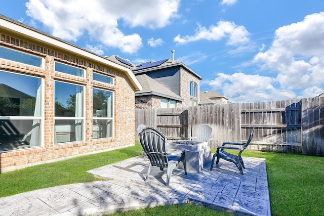 view of patio featuring fence and an outdoor fire pit