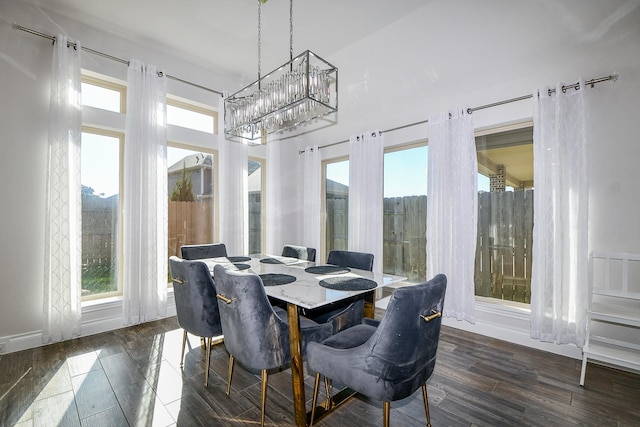 sunroom / solarium featuring an inviting chandelier