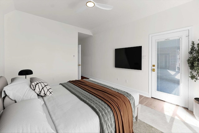 bedroom with ceiling fan, light wood-style flooring, baseboards, and access to exterior