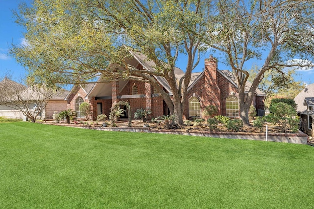 view of front facade with a front lawn, brick siding, and a chimney