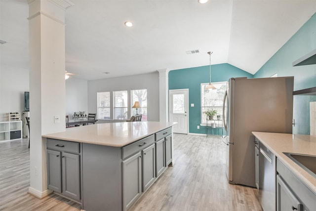 kitchen featuring decorative columns, a healthy amount of sunlight, visible vents, and gray cabinetry