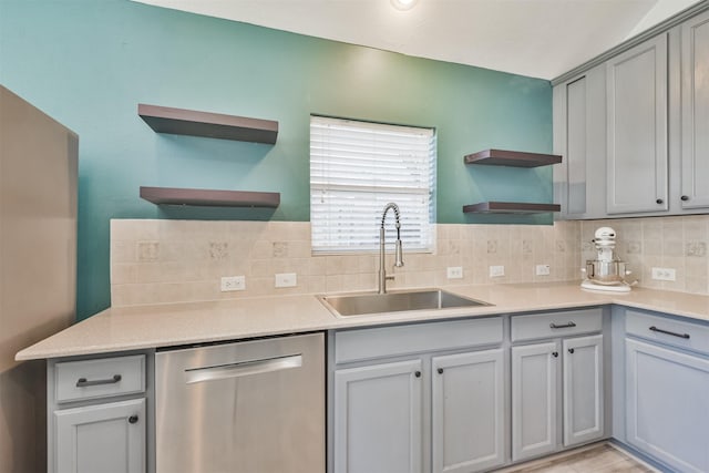 kitchen with a sink, stainless steel dishwasher, decorative backsplash, and open shelves