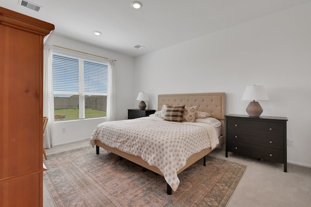 bedroom featuring recessed lighting, baseboards, visible vents, and light carpet