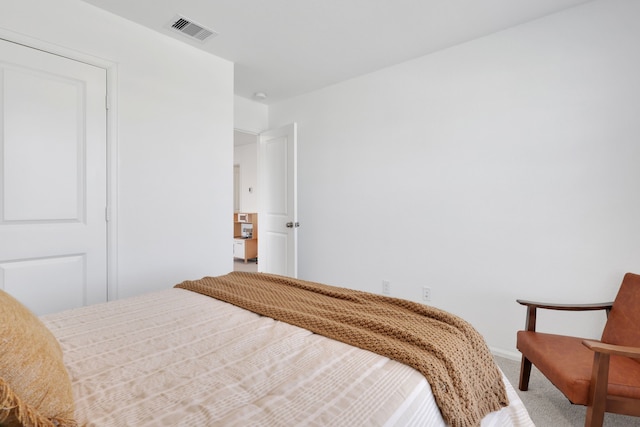 bedroom featuring carpet and visible vents