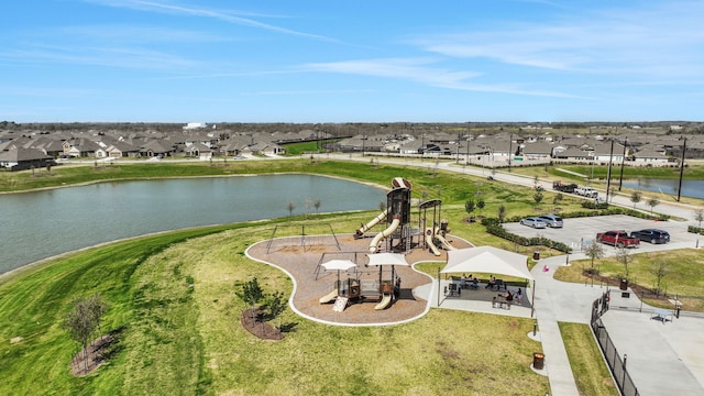 bird's eye view with a residential view and a water view