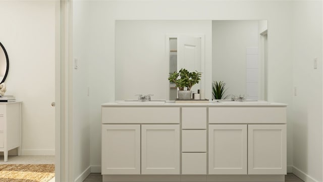 3012 Ruby Ridge Dr, Katy, TX 77493 - full bathroom featuring double vanity, baseboards, and a sink