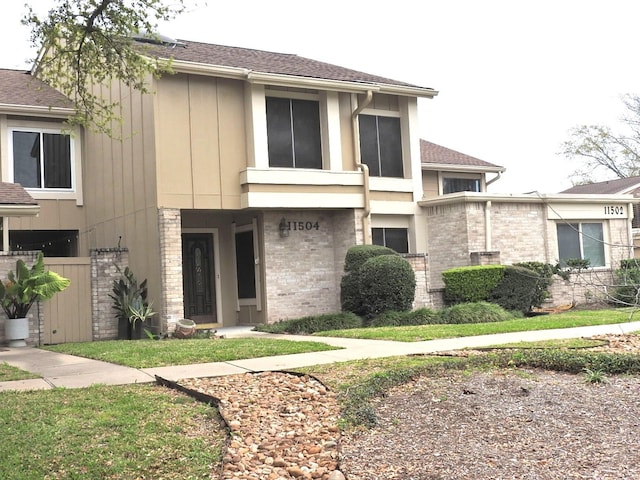 view of front of house featuring brick siding