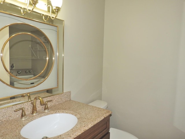 bathroom featuring toilet and vanity