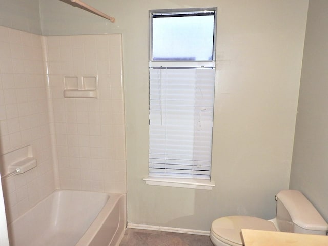 full bath featuring shower / bath combination, baseboards, and toilet