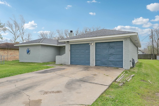 garage with driveway and fence