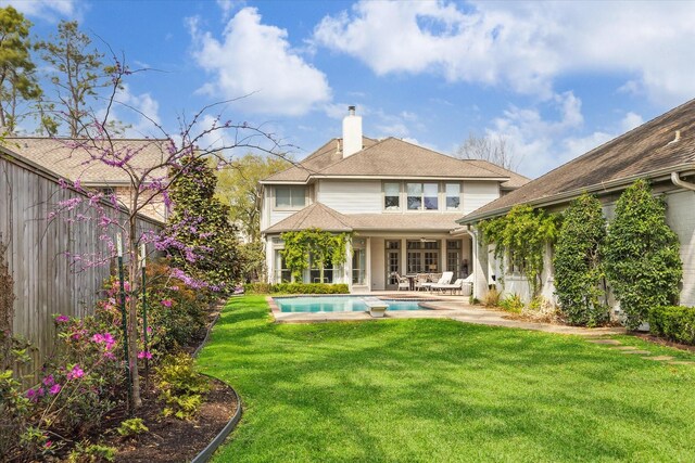 8521 Burkhart Rd, Spring Valley Village, TX 77055 - back of house with a patio, a fenced backyard, a yard, an outdoor pool, and a chimney
