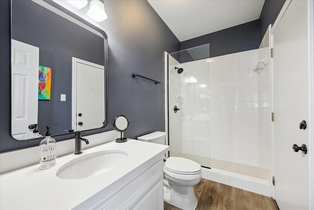 8521 Burkhart Rd, Spring Valley Village, TX 77055 - bathroom with toilet, wood finished floors, vanity, and a tile shower