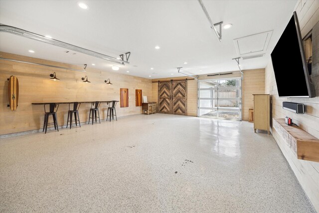 8521 Burkhart Rd, Spring Valley Village, TX 77055 - garage with recessed lighting and wood walls