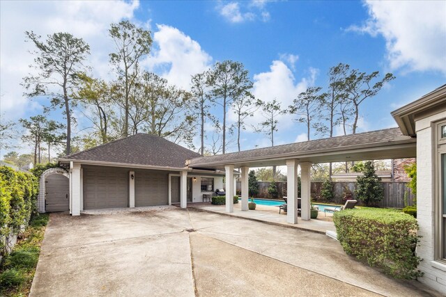 8521 Burkhart Rd, Spring Valley Village, TX 77055 - exterior space with a patio, an attached garage, fence, and a shingled roof