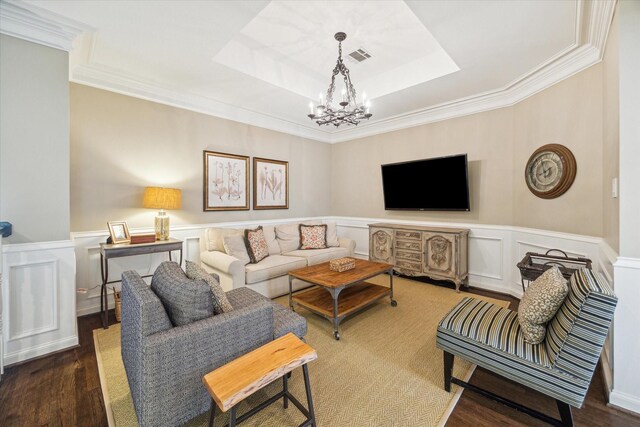 8521 Burkhart Rd, Spring Valley Village, TX 77055 - living area featuring wood finished floors, a wainscoted wall, visible vents, a raised ceiling, and a chandelier