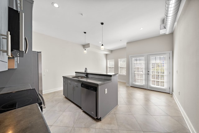 kitchen featuring electric range, an island with sink, a sink, stainless steel dishwasher, and light tile patterned floors