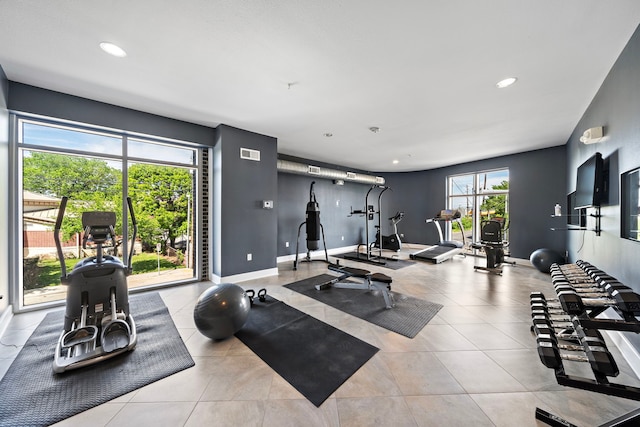 gym featuring recessed lighting, visible vents, baseboards, and tile patterned floors