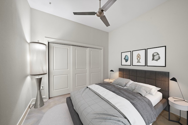 bedroom with baseboards, a closet, and ceiling fan