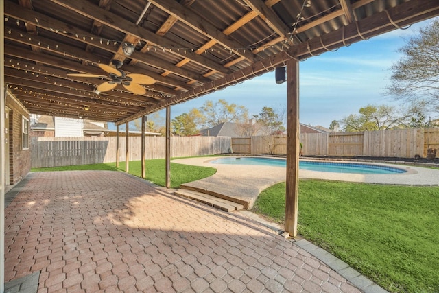 view of patio / terrace featuring a fenced backyard, a fenced in pool, and ceiling fan