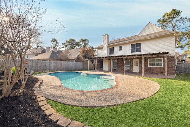 view of swimming pool with a fenced in pool, a patio, a lawn, and a fenced backyard