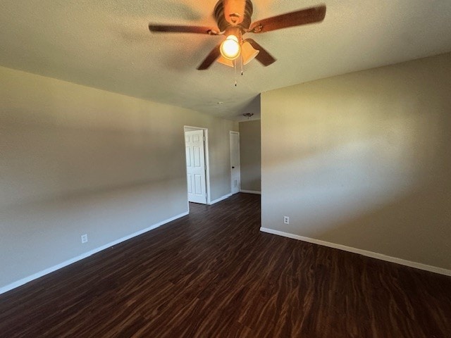 4706 Yellowstone Blvd, Houston, TX 77021 - spare room with ceiling fan, baseboards, a textured ceiling, and dark wood finished floors