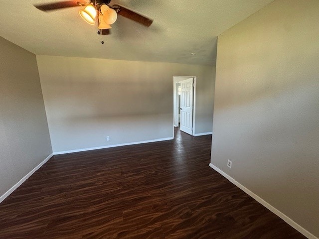 4706 Yellowstone Blvd, Houston, TX 77021 - empty room with a textured ceiling, dark wood-style floors, baseboards, and ceiling fan