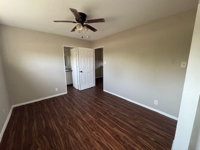 4706 Yellowstone Blvd, Houston, TX 77021 - empty room featuring dark wood finished floors, a ceiling fan, and baseboards