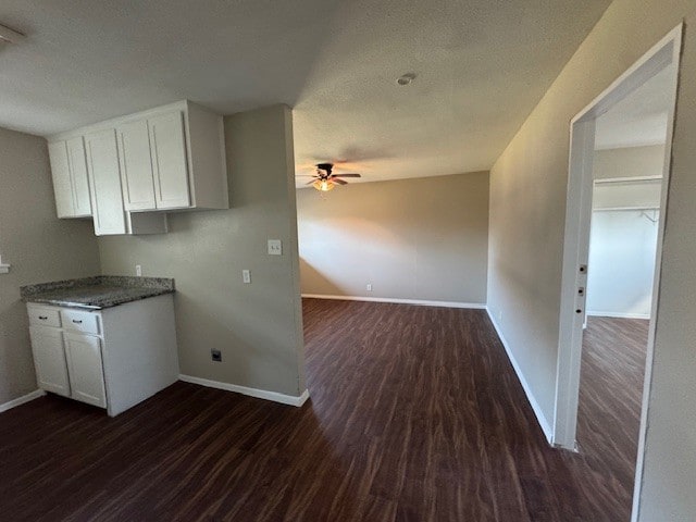 4706 Yellowstone Blvd, Houston, TX 77021 - kitchen with white cabinetry, dark wood-style floors, and ceiling fan