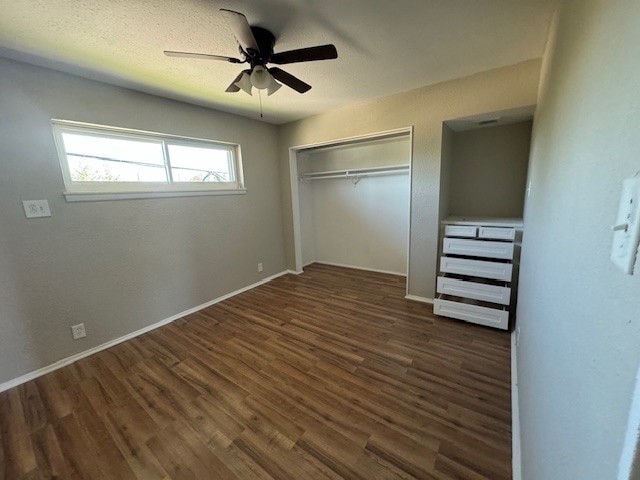 4706 Yellowstone Blvd, Houston, TX 77021 - unfurnished bedroom with ceiling fan, wood finished floors, a closet, and baseboards