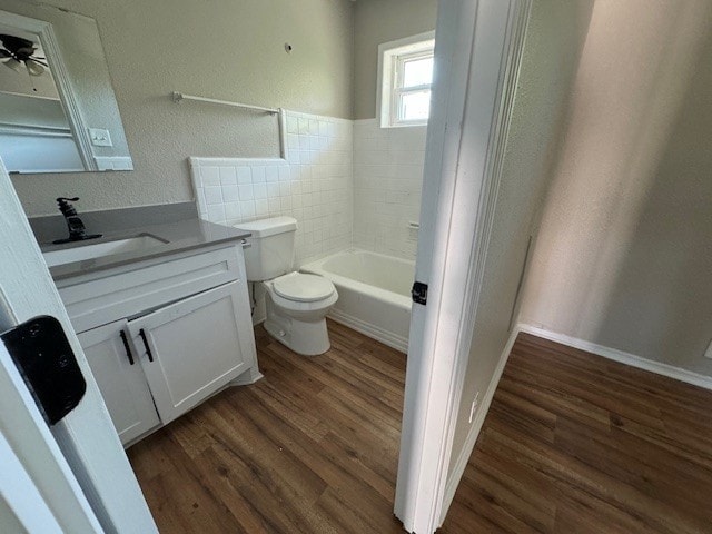 4706 Yellowstone Blvd, Houston, TX 77021 - bathroom featuring a tub, toilet, wood finished floors, and vanity