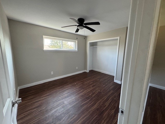 4706 Yellowstone Blvd, Houston, TX 77021 - unfurnished bedroom featuring dark wood finished floors, a closet, baseboards, and a ceiling fan