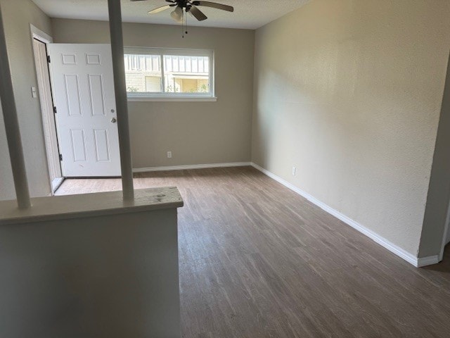 4706 Yellowstone Blvd, Houston, TX 77021 - spare room featuring baseboards, wood finished floors, a textured ceiling, and ceiling fan