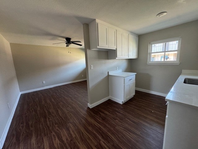 4706 Yellowstone Blvd, Houston, TX 77021 - interior space with baseboards, dark wood-type flooring, and a ceiling fan
