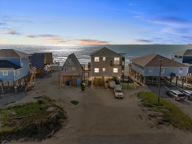 109 Beach Dr, Surfside Beach, TX 77541 - aerial view at dusk featuring a water view