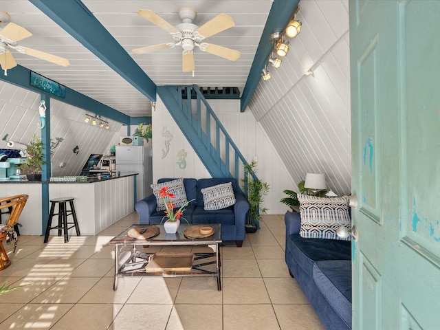109 Beach Dr, Surfside Beach, TX 77541 - living room with light tile patterned floors, stairs, and ceiling fan