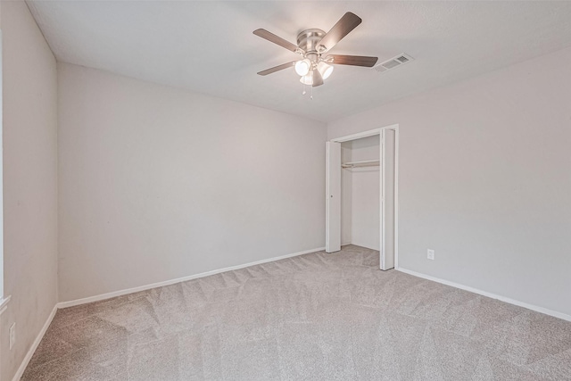 unfurnished bedroom with visible vents, baseboards, and light colored carpet