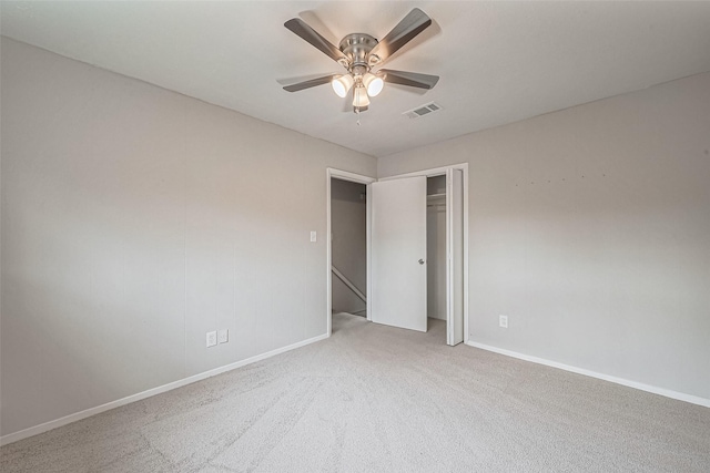 unfurnished bedroom with visible vents, baseboards, carpet flooring, and a closet
