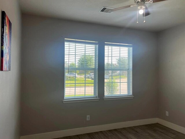 14538 Burleson Bend Dr, Houston, TX 77049 - empty room featuring visible vents, baseboards, ceiling fan, and wood finished floors