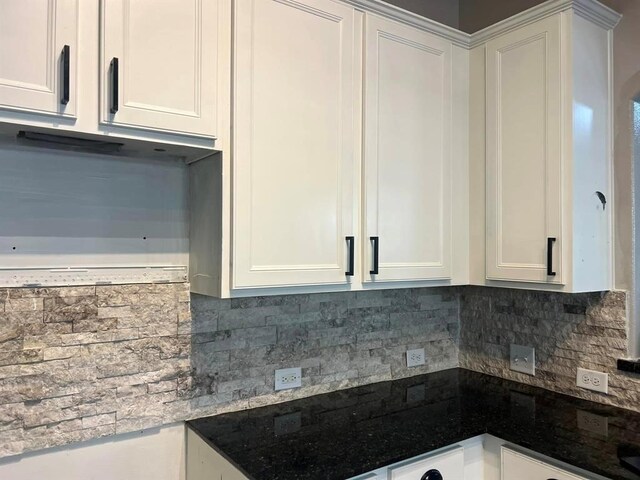 14538 Burleson Bend Dr, Houston, TX 77049 - kitchen featuring backsplash and white cabinets