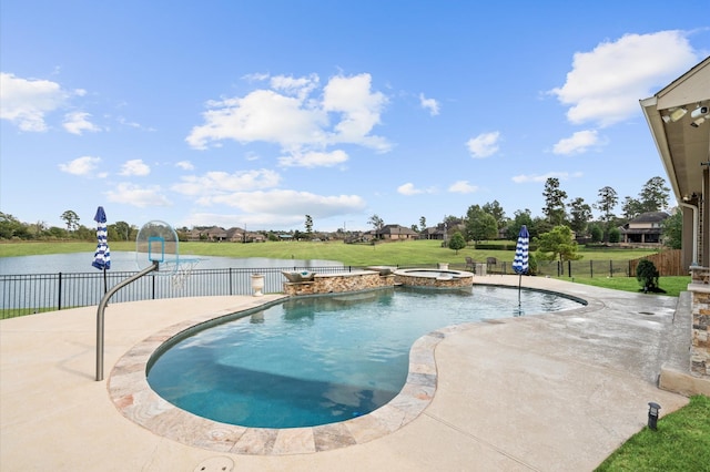 view of pool with a yard, a patio area, and fence