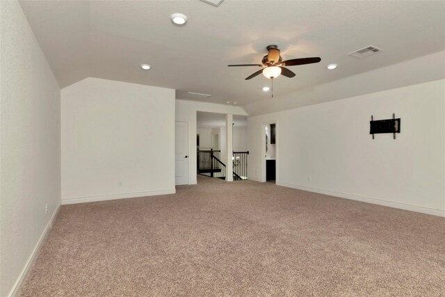 spare room with ceiling fan, light colored carpet, recessed lighting, and visible vents
