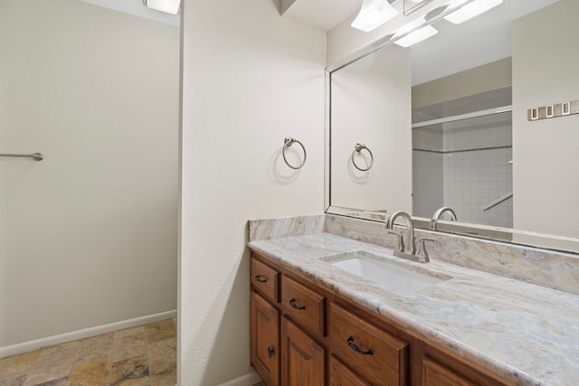 bathroom featuring vanity and baseboards