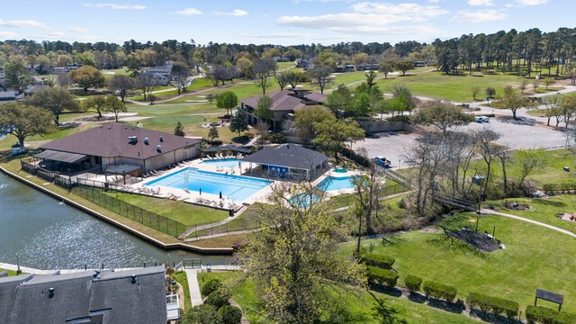 birds eye view of property with a water view